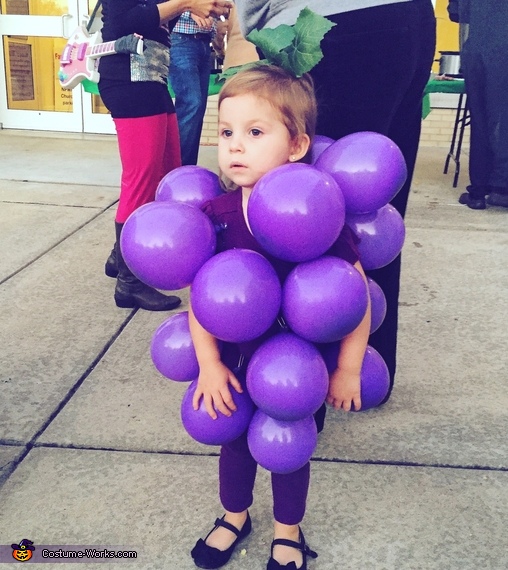 Girl dressed as grapes